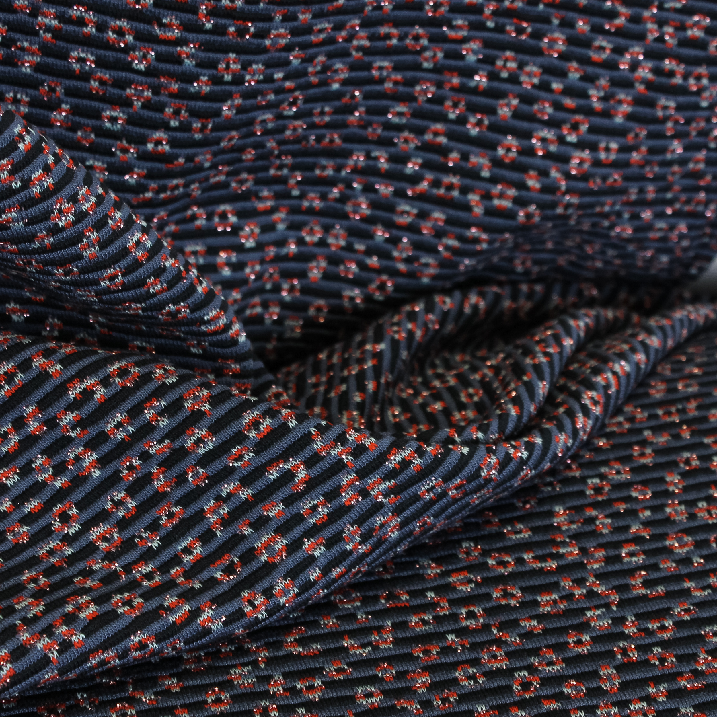 Polyester tricot gebreid blauw met glitter motief